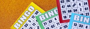 Many colorful bingo boards or playing cards for winning chips